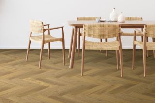 neutral Scandi dining table and chairs with natural herringbone engineered wood flooring